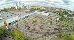Subway depot with many railways at day in city.