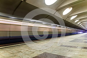 Subway metro train arriving at a station