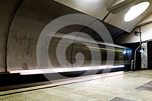 Subway metro train arriving at a station