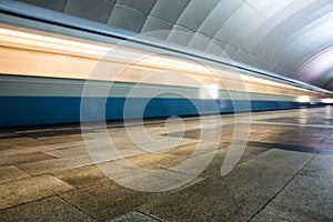 Subway metro train arriving at a station