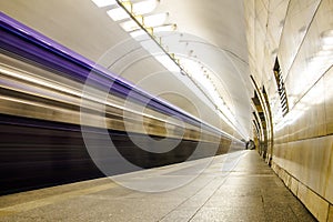 Subway metro train arriving at a station