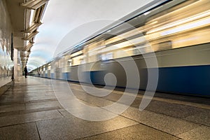 Subway metro train arriving at a station