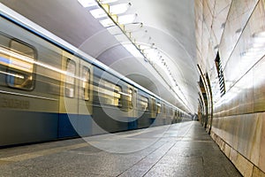 Subway metro train arriving at a station