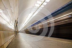 Subway metro train arriving at a station