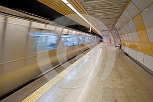 Subway train approaching a platform