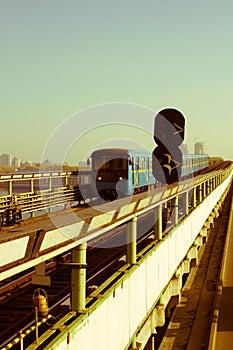 Subway train on metro-bridge, approaching Dnipro station, Kiev, Ukraine.