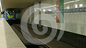 Subway train moving on a subway station.