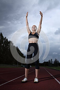 Success arms raised for female athlete on track