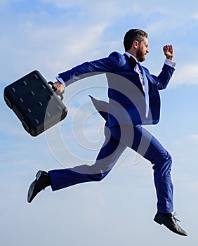 Success in business demands supernatural efforts from entrepreneur personality. Businessman with briefcase jump high