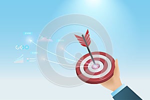 Success business marketing target. Businessman hand hold dartboard hit on red target with growth graph and business report.