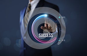 Success in business or personal success concept. Businessman is pulling up circle progress bar with the word SUCCESS on dark tone