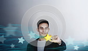 Success in Business or Personal Talent Concept. Happy Businessman Employee Smiling and Showing a Golden Star