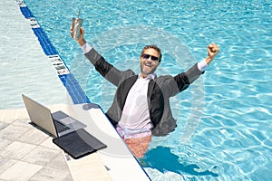 Success businessman. Business success. Successful office worker in suit in water. Successful business. Summer successful