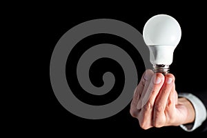 Success businessman hold lightbulb for success business creative thinking idea concept with suit during work in office and