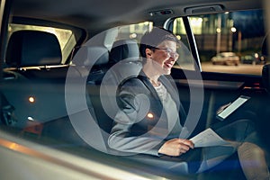 Success businesswoman working late in car