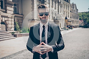 Success concept. Stylish elegant harsh bearded guy in a suit and