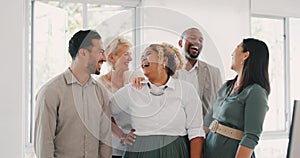 Success, happy or funny business people in an office building laughing at a funny joke after a group meeting. Diversity