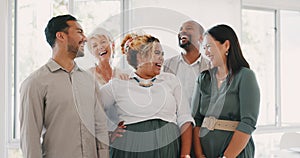 Success, happy or funny business people in an office building laughing at a funny joke after a group meeting. Diversity