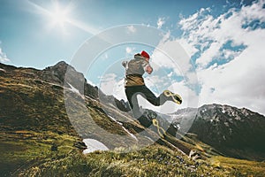 Success Man jumping up in mountains