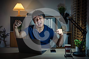 success man working with laptop at night