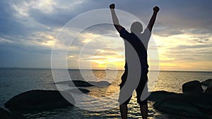 Success Pose of Businessman Standing on Top of a rock Raising Hands. slow motion. 1920x1080