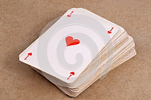 Success and power concept with an ace of hearts on a pile of playing cards