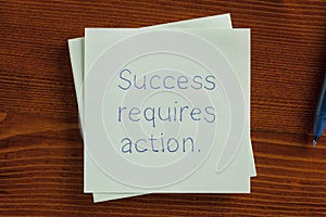 Success requires action handwritten on note