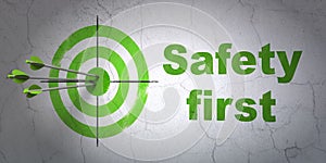 Security concept: target and Safety First on wall background