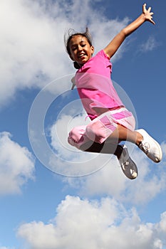 Success shows in excited girl leaping in the air