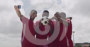 Success, stadium or soccer team in group selfie after goals, achievement or victory together on field. Happy people