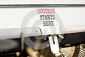 Success starts here symbol. Concept word Success starts here typed on beautiful retro old typewriter. Beautiful white paper