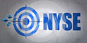 Stock market indexes concept: target and NYSE on wall background photo