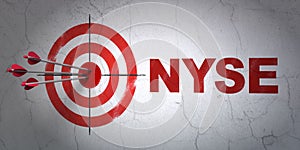 Stock market indexes concept: target and NYSE on wall background photo