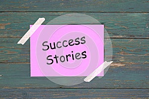 Success stories on pink paper