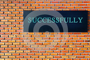 Success text on brick wall