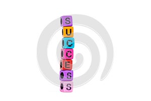 SUCCESS text made from colorful beads or letter bead on white ba
