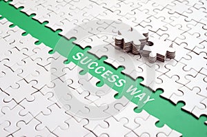 Success way. The green path is laid on the platform of a white f