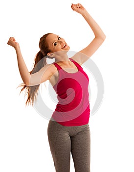 Success - woman gesturing victory with her hands raised in the a