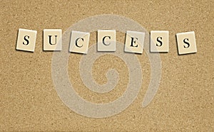 Success word on cork board photo