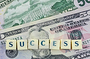 Success word on dollar background. Finance concept