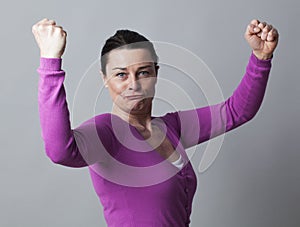 Successful 40s woman proud of showing her muscles