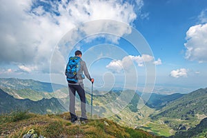 Successful active man hiker on top of mountain enjoying the view. Travel sport lifestyle concept