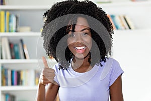 Successful african american woman showing thumb up
