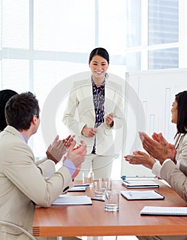 Successful asian woman giving a presentation