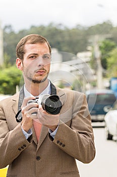Successful attractive male photographer wearing photo
