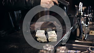 Successful bar robbery. The robber breaks into a bar and takes the money