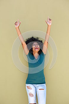Successful beautiful woman with outstretched arms smiling