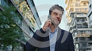 Successful business man calling on street waiting business meeting close up.