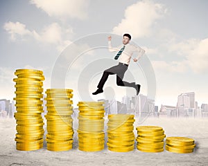 Successful business man jumping up on gold coin money