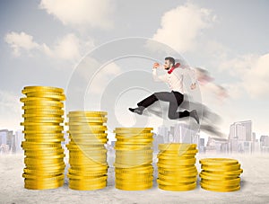 Successful business man jumping up on gold coin money